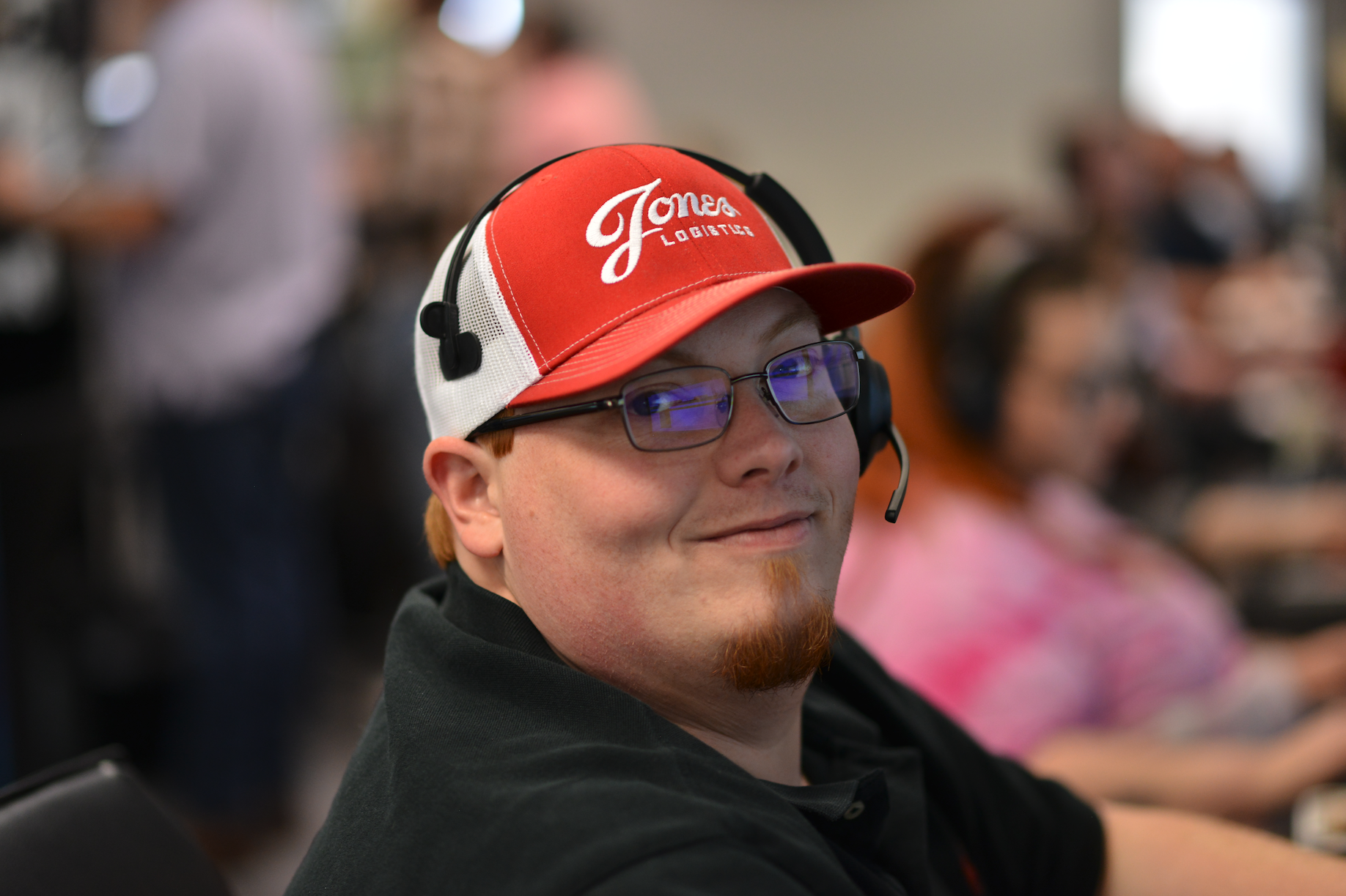 Jones employee sitting at his desk smiling